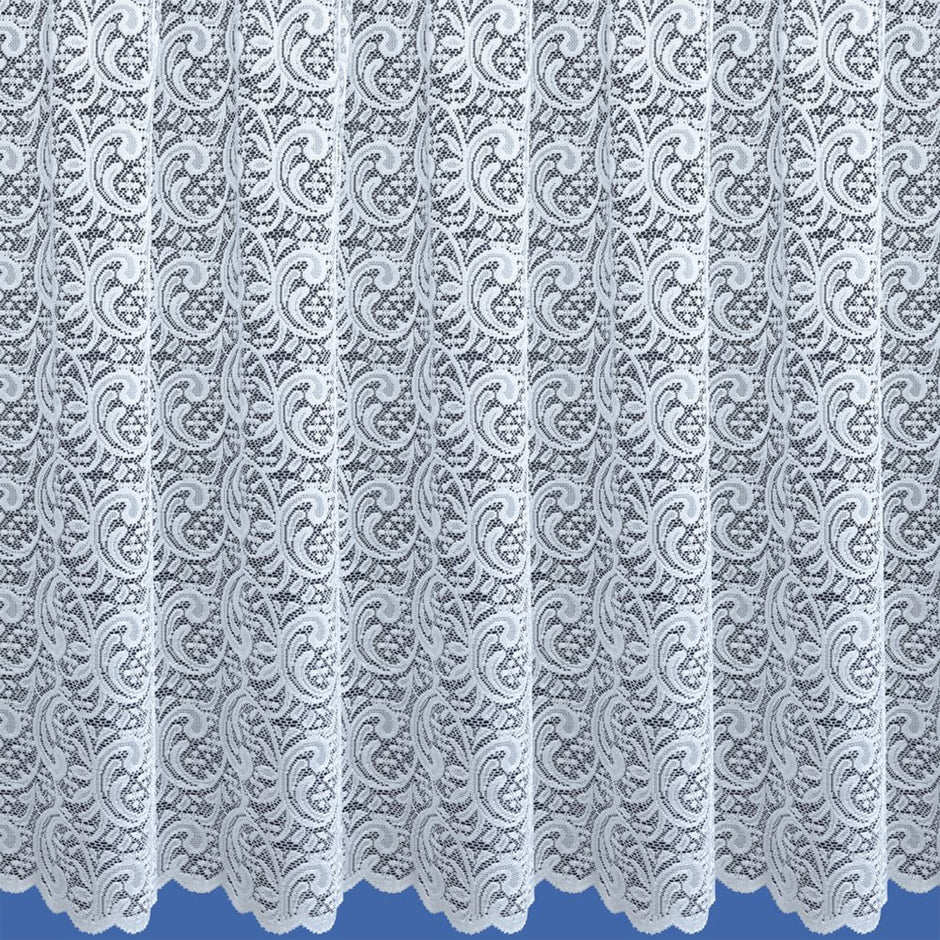Lace curtain with intricate pattern on a blue background