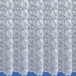 Lace curtain with intricate pattern on a blue background