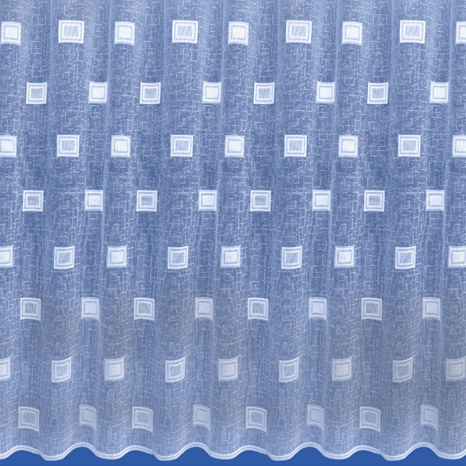 Whit net curtain with embroidered squares against a blue background