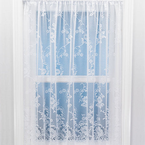 Sheer white floral lace curtain panel on a light blue background
