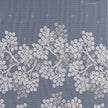 Decorative white floral pattern on a blue background