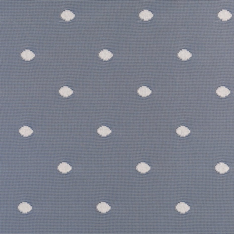 Pattern of white circles on lace curtains against a blue textured background