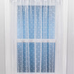 Sheer curtain with white polka dots on a blue background