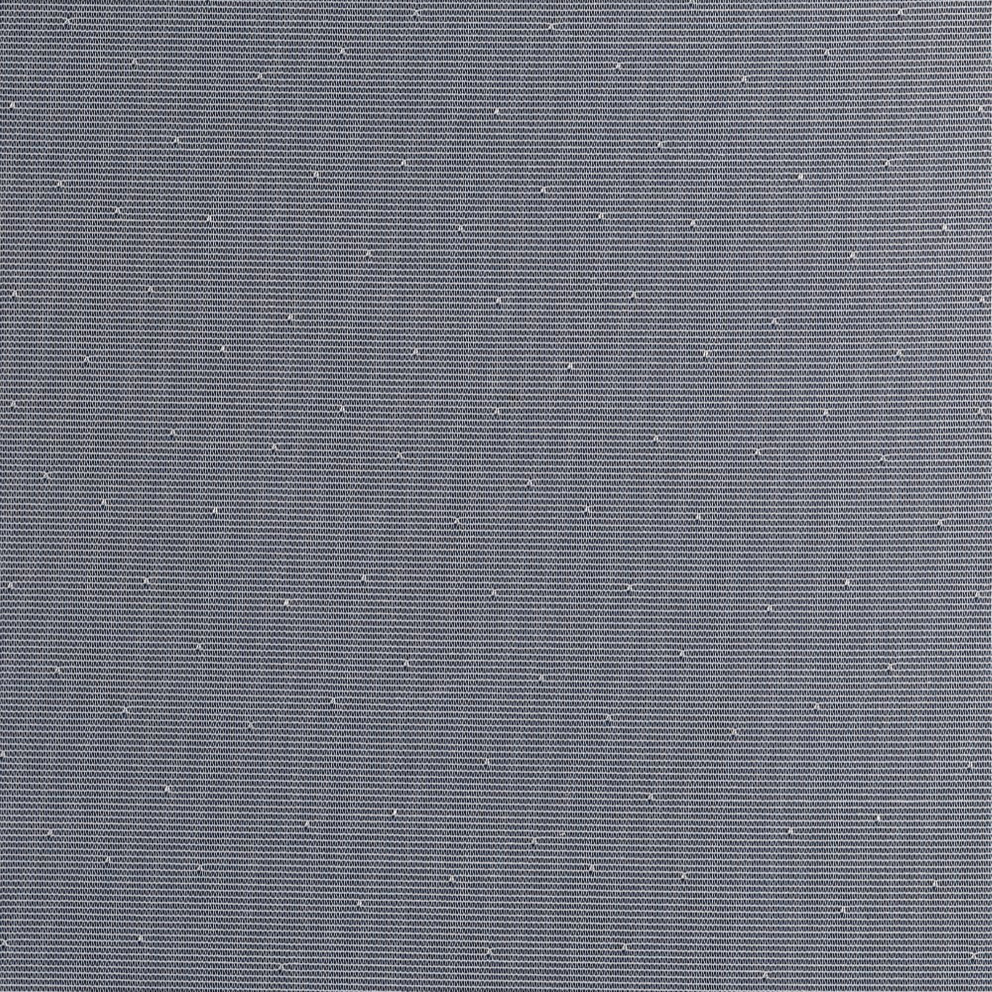 White lace curtain with tiny dots against a blue background