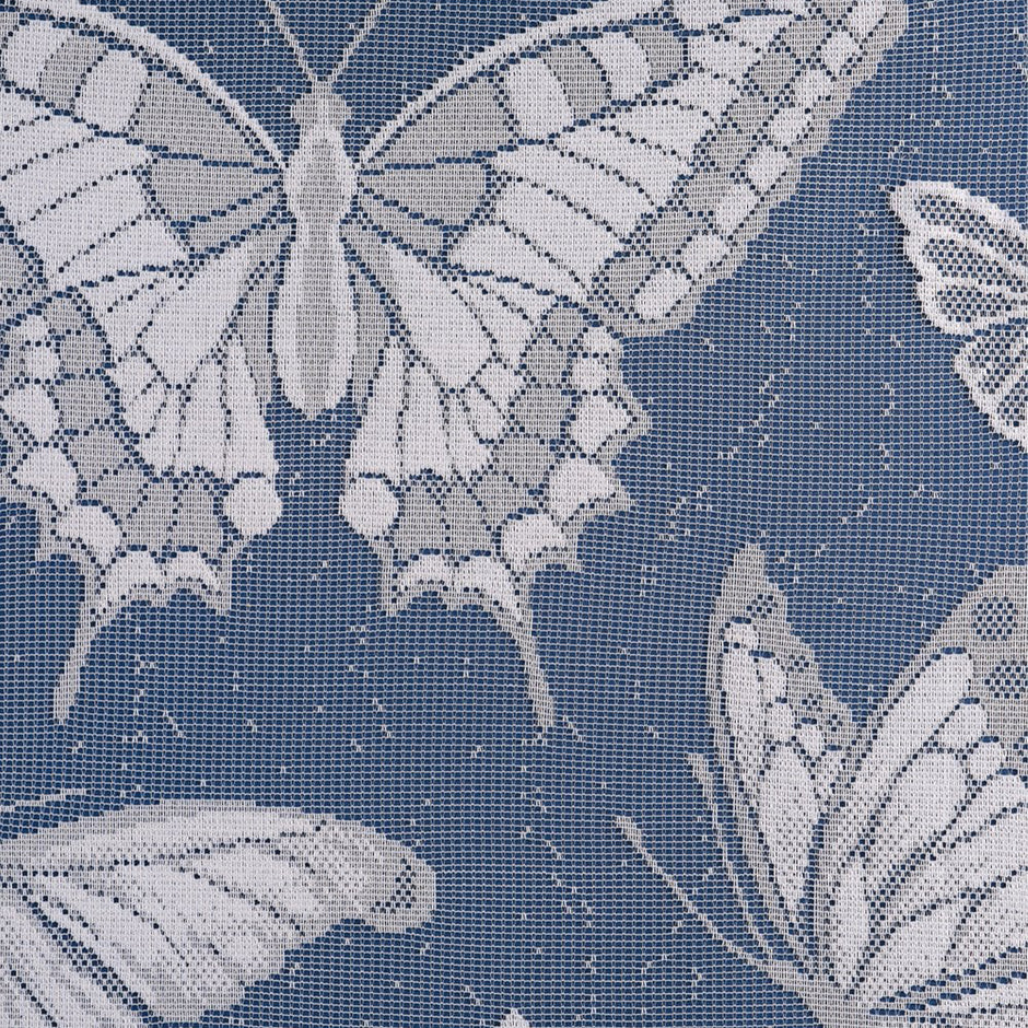 Butterfly pattern on lace curtains against a blue background