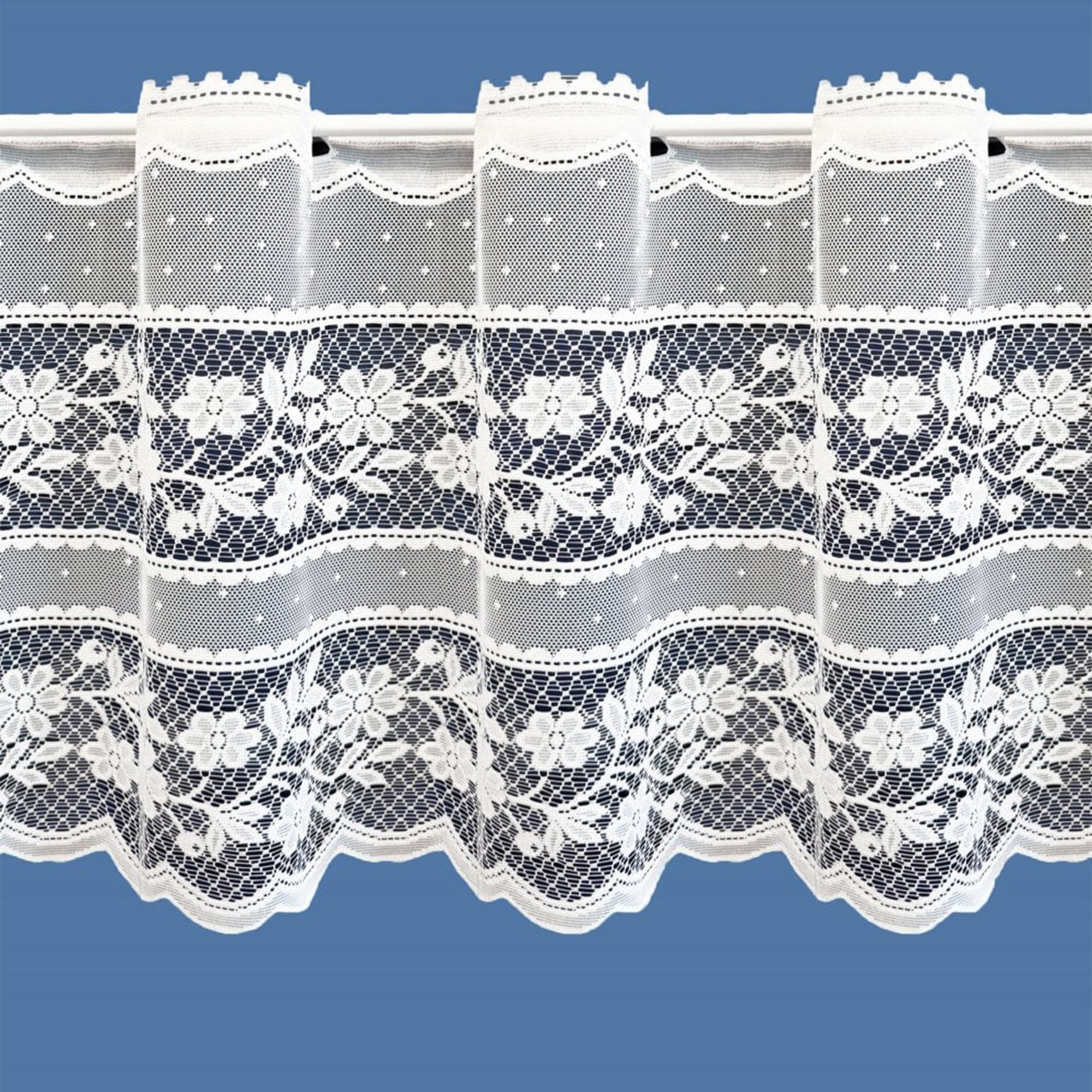 Lace curtain with floral patterns on a blue background