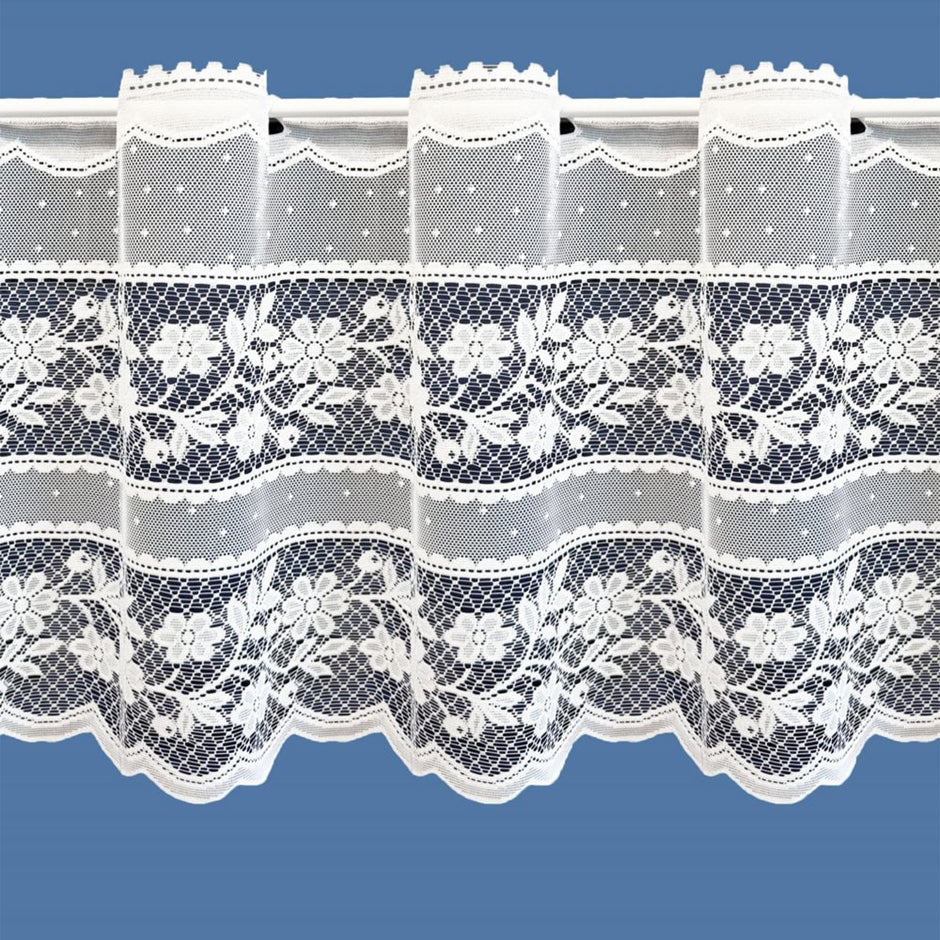 Lace curtain with floral patterns on a blue background