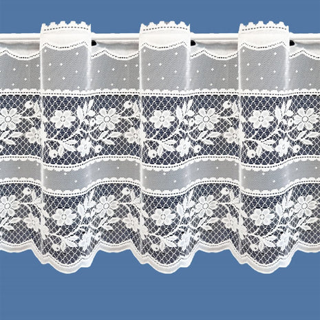 Lace curtain with floral patterns on a blue background